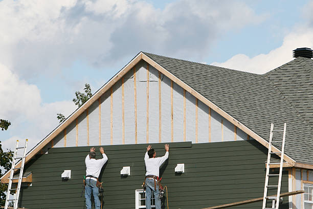 Professional Siding technician working in East Sparta, OH